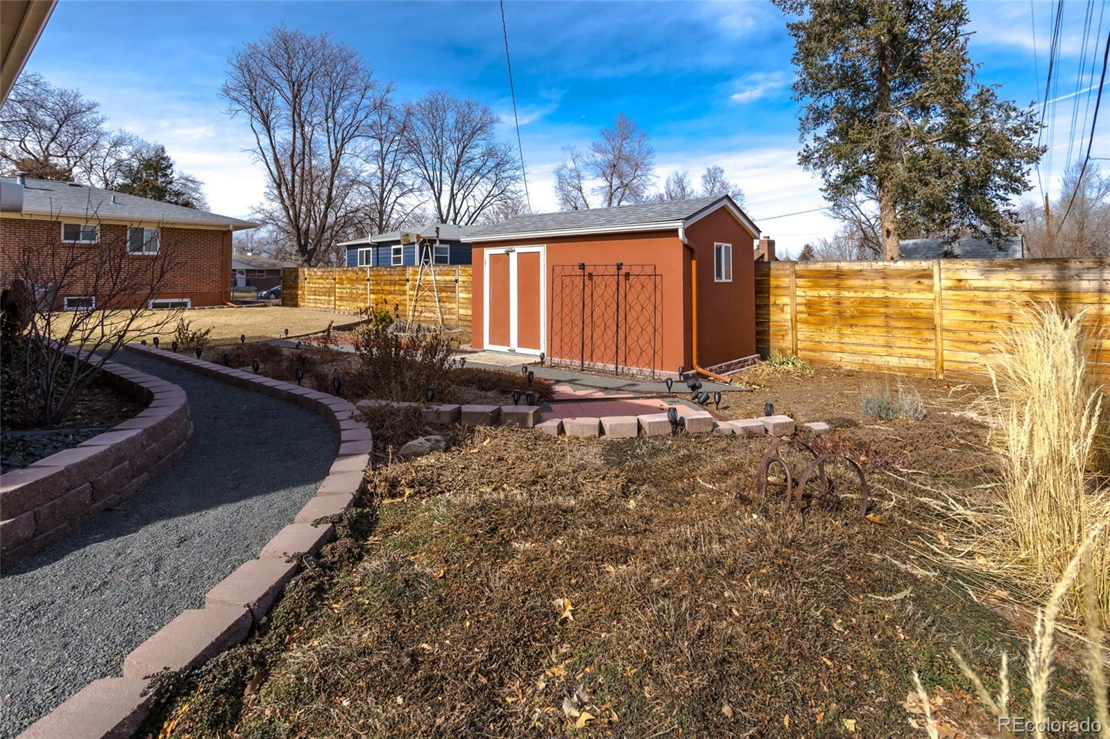 4530 South Inca Street Englewood, CO 80110 - Photo 35 of 37 a view of a house with backyard and trees