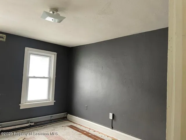 a view of an empty room and window