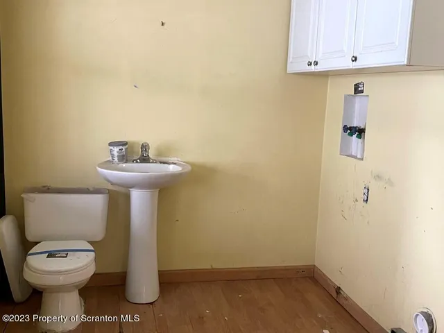 a bathroom with a toilet and a sink