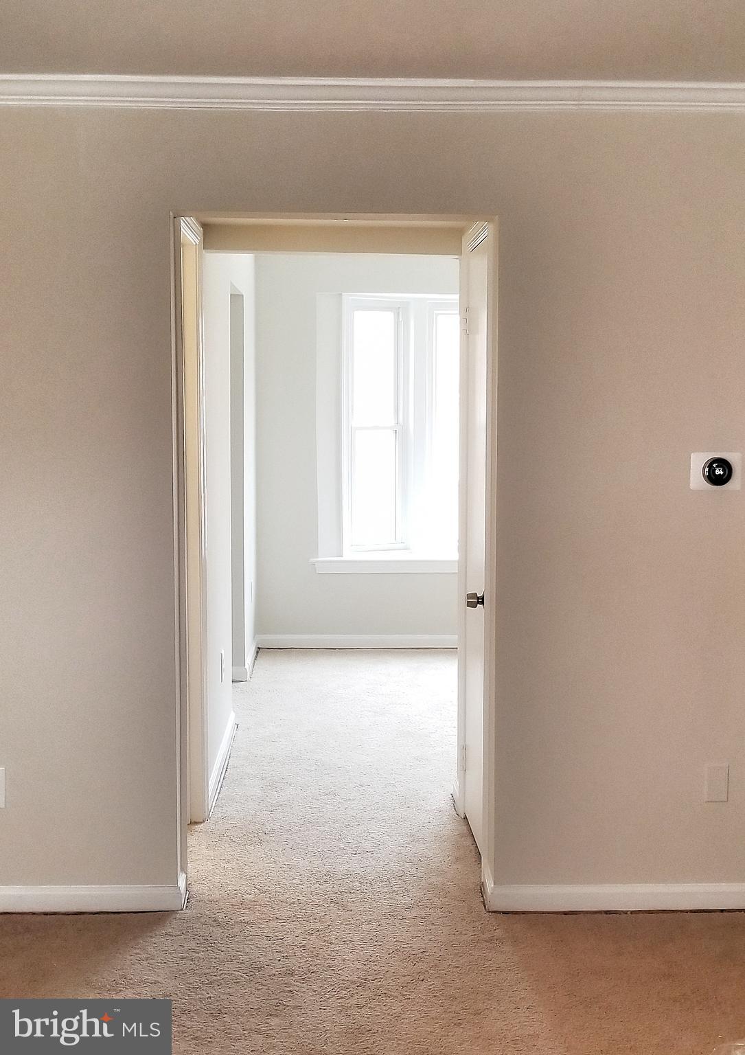 1763 Addison Road South District Heights, MD 20747 - Photo 5 of 23 Hallway to half bah, kitchen, and dinning room.
