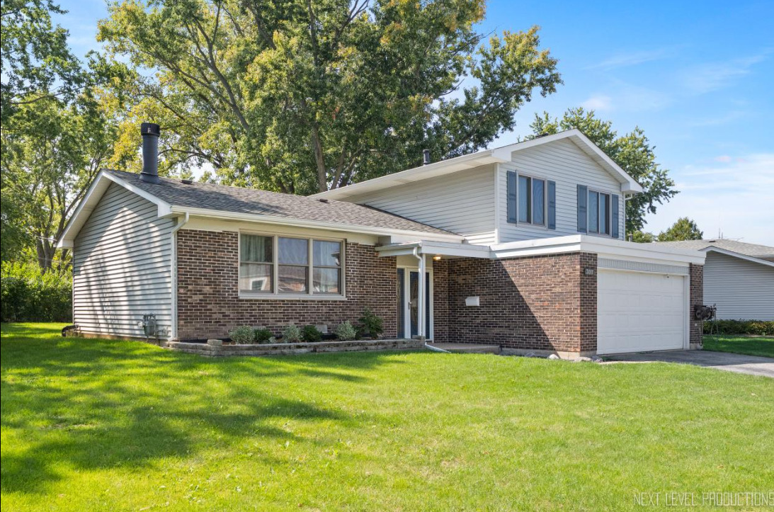 3011 Scenicwood Lane Woodridge, IL 60517 - Photo 1 of 21 a front view of house with a garden