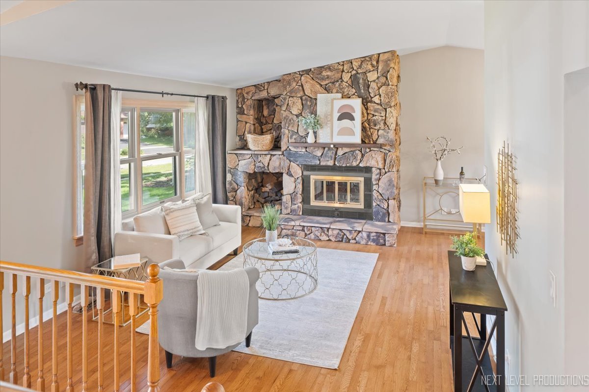 3011 Scenicwood Lane Woodridge, IL 60517 - Photo 2 of 21 a living room with furniture and a fireplace