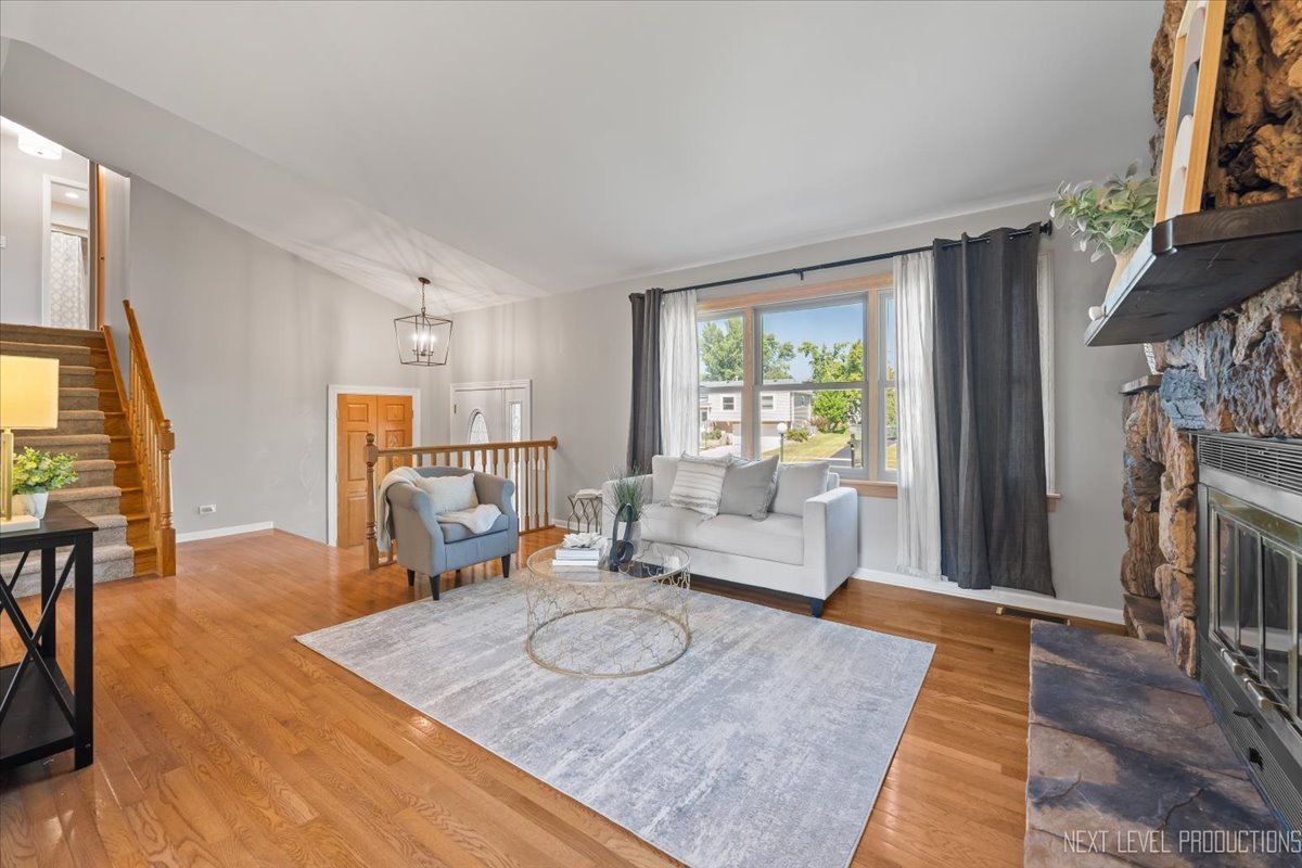 3011 Scenicwood Lane Woodridge, IL 60517 - Photo 5 of 21 a living room with furniture and a fireplace