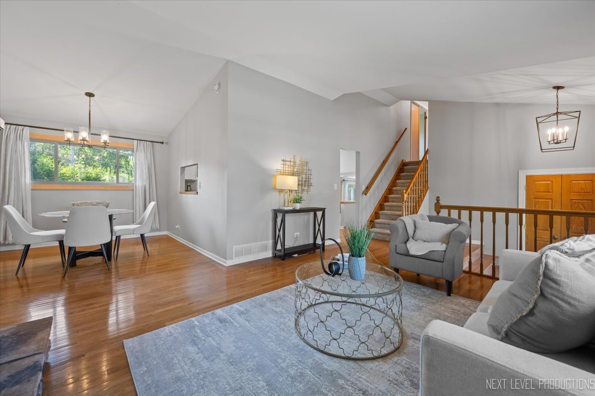 3011 Scenicwood Lane Woodridge, IL 60517 - Photo 6 of 21 a living room with furniture and a wooden floor