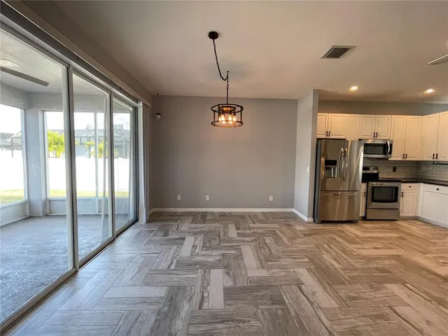a view of room with a ceiling fan