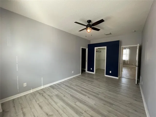 a bathroom with a double vanity sink mirror double and bathtub