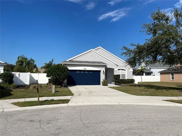 a view of empty room with cabinet and wooden floor