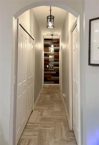 a living room with furniture a rug and a window