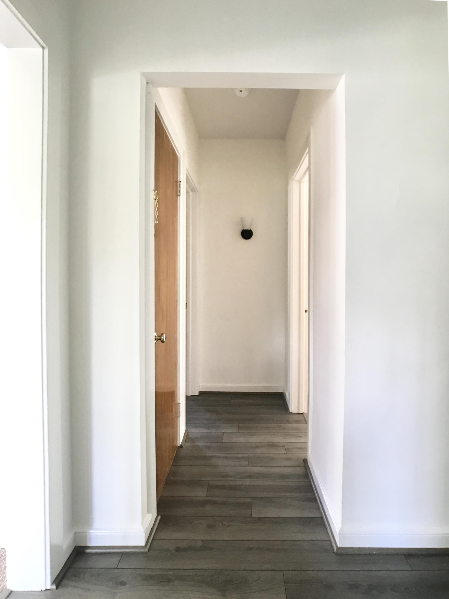 170 Hollow Tree Ridge Road Darien, CT 06820 - Photo 7 of 18 a view of a hallway with wooden floor