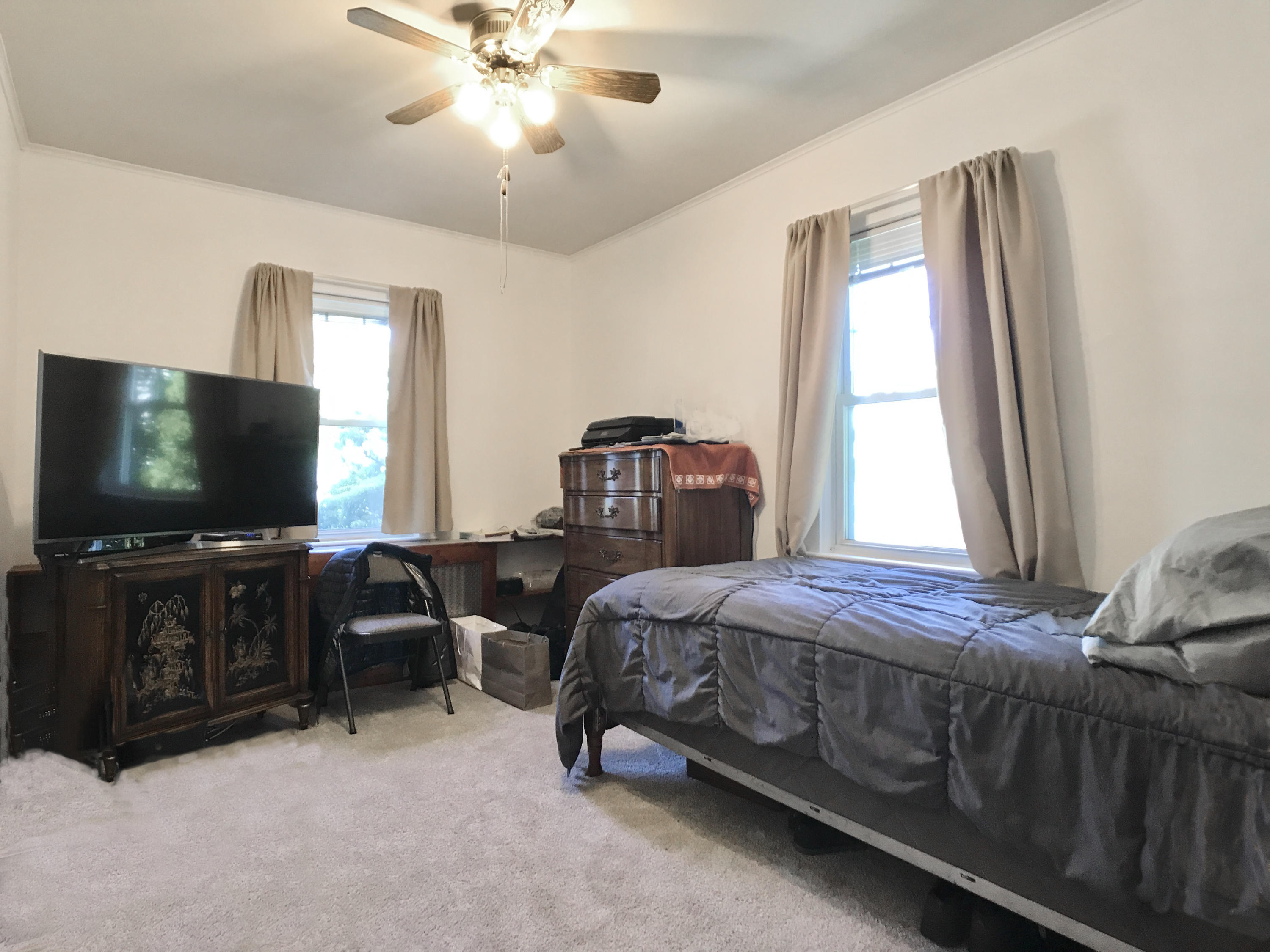 170 Hollow Tree Ridge Road Darien, CT 06820 - Photo 8 of 18 a bedroom with bed tv and window