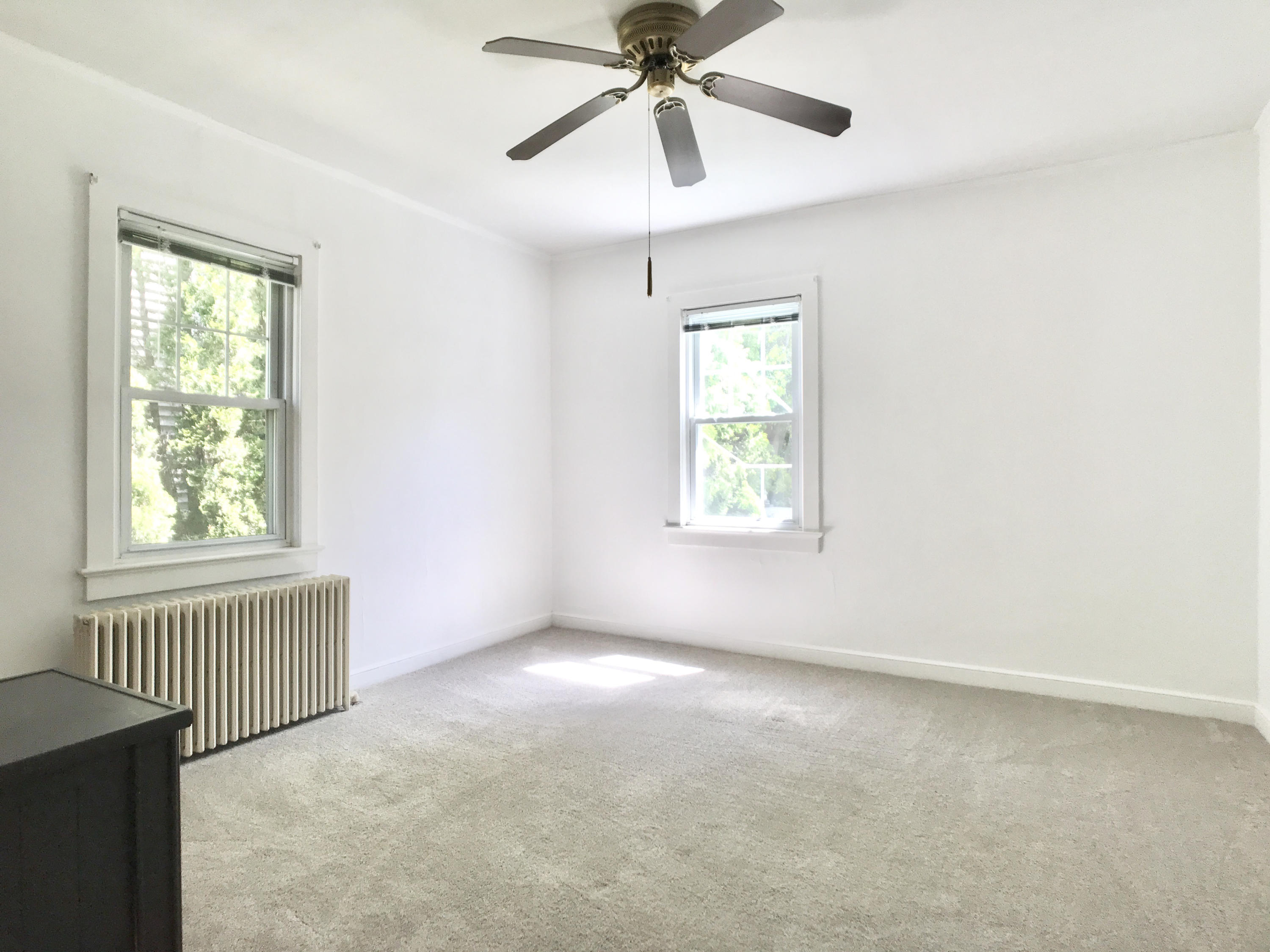 170 Hollow Tree Ridge Road Darien, CT 06820 - Photo 9 of 18 an empty room with windows and fan