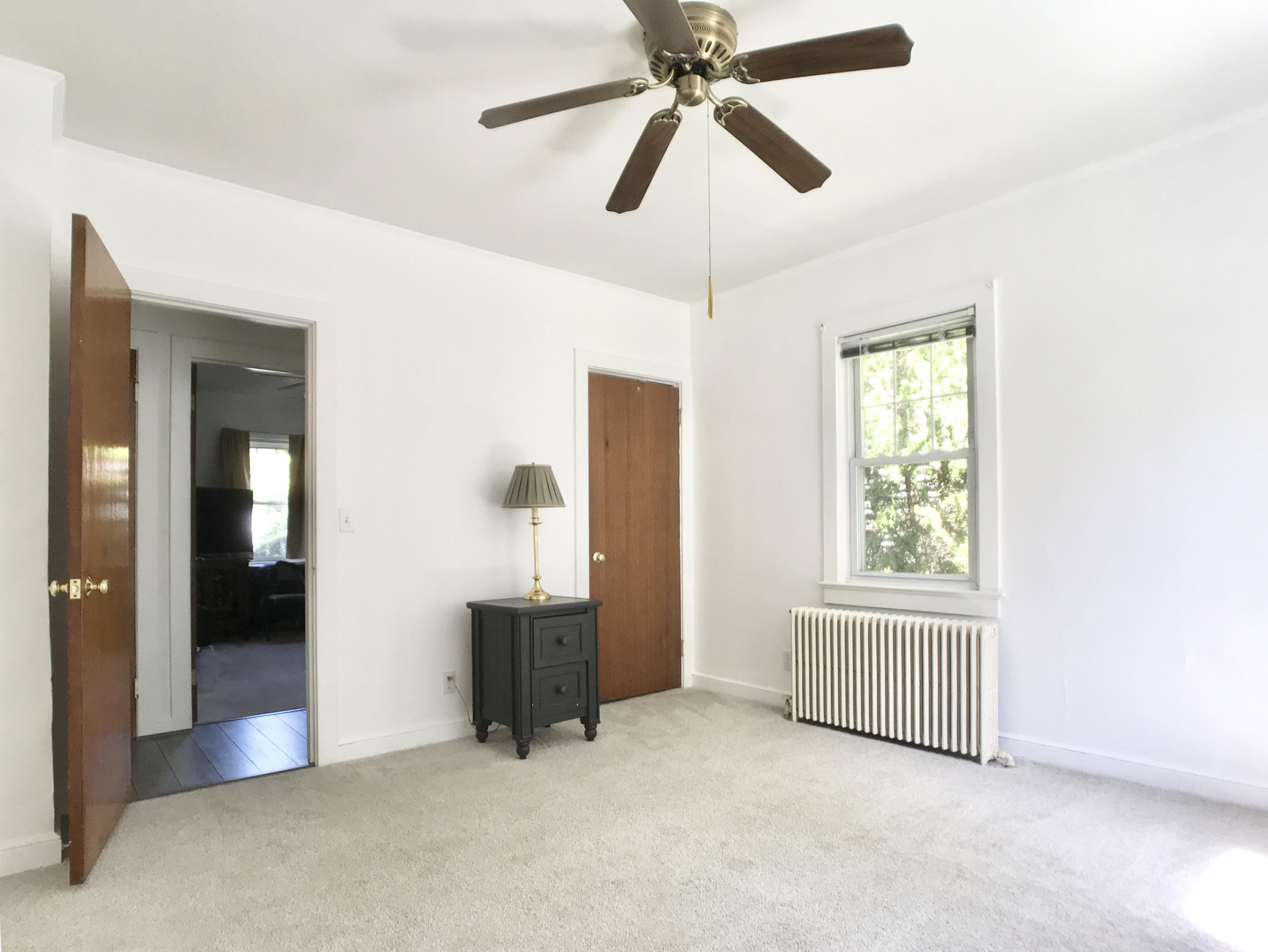 170 Hollow Tree Ridge Road Darien, CT 06820 - Photo 10 of 18 an empty room with windows and fan