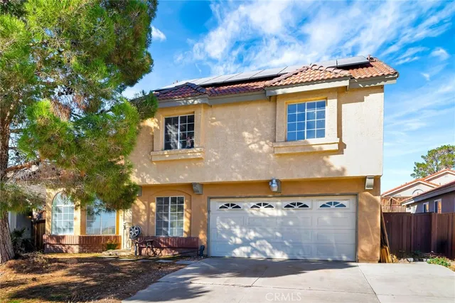 a front view of a house with a garage