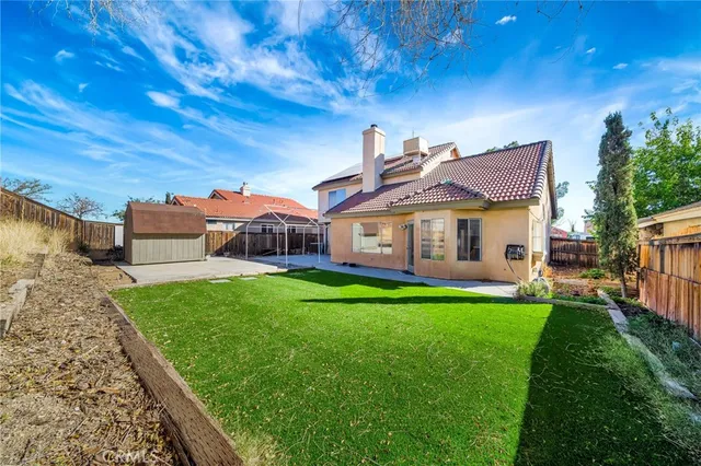 a view of a house with a yard porch and sitting area