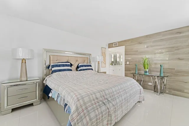 a bathroom with a sink a mirror and a shower