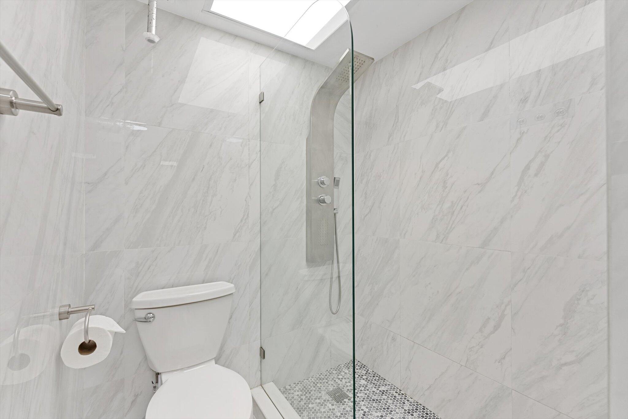 3730 Inverrary Drive, Unit 2L Lauderhill, FL 33319 - Photo 17 of 17 a bathroom with a toilet and a shower