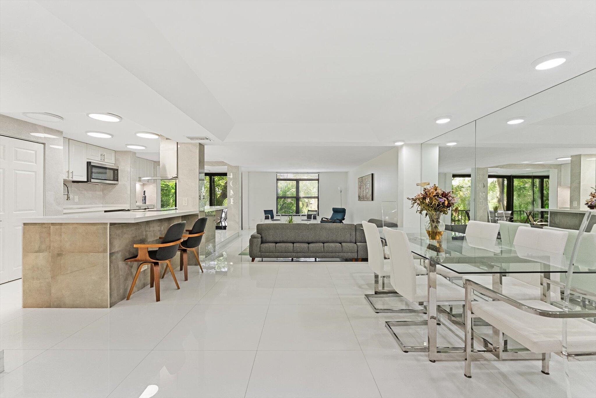 3730 Inverrary Drive, Unit 2L Lauderhill, FL 33319 - Photo 3 of 17 a view of a dining room with furniture