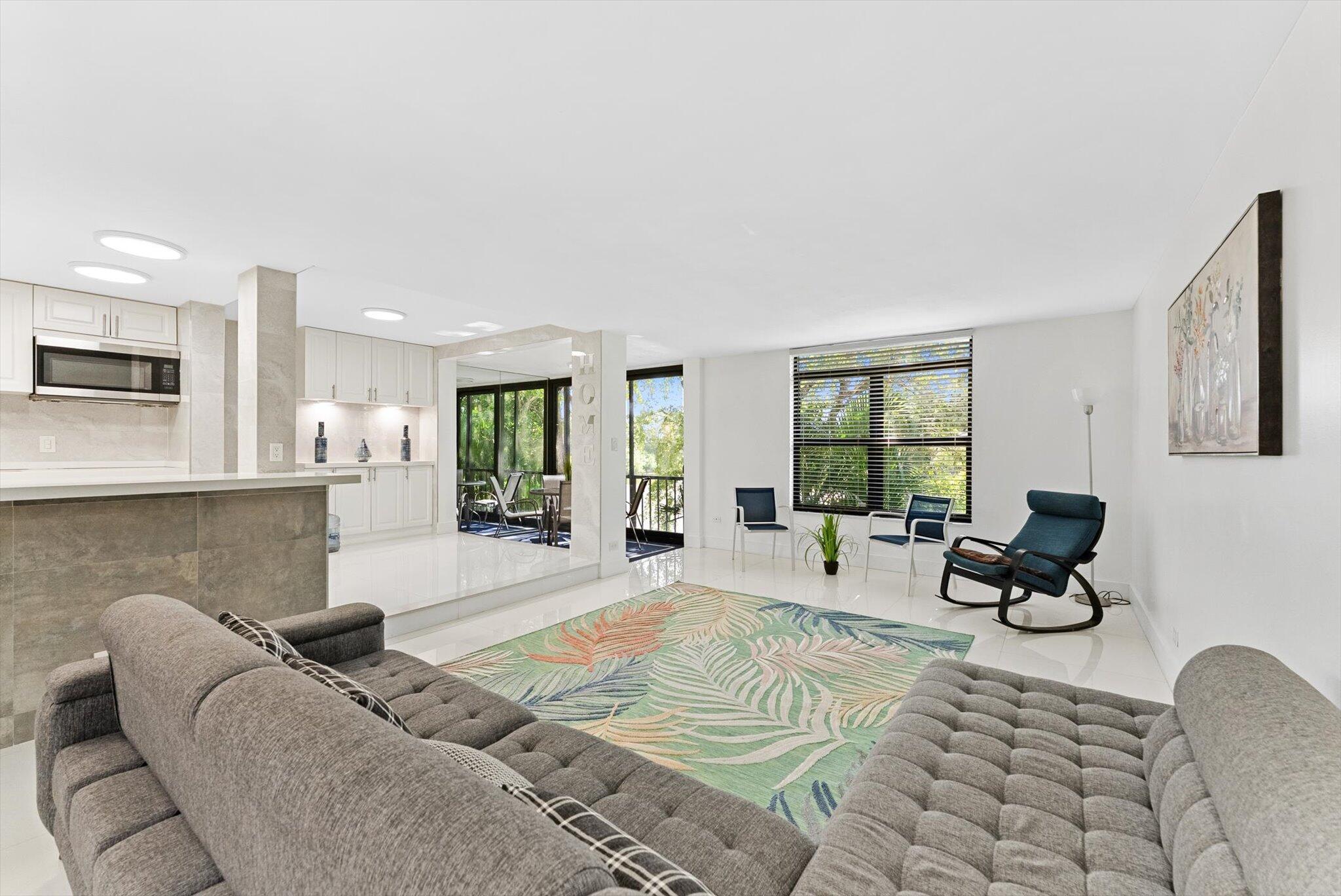 3730 Inverrary Drive, Unit 2L Lauderhill, FL 33319 - Photo 6 of 17 a living room with furniture