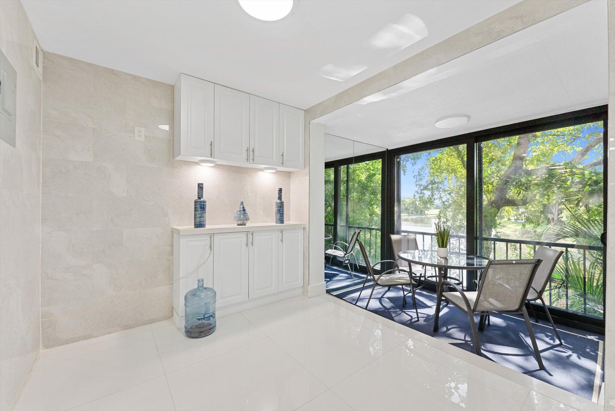 3730 Inverrary Drive, Unit 2L Lauderhill, FL 33319 - Photo 7 of 17 a view of a work space with furniture and a potted plant