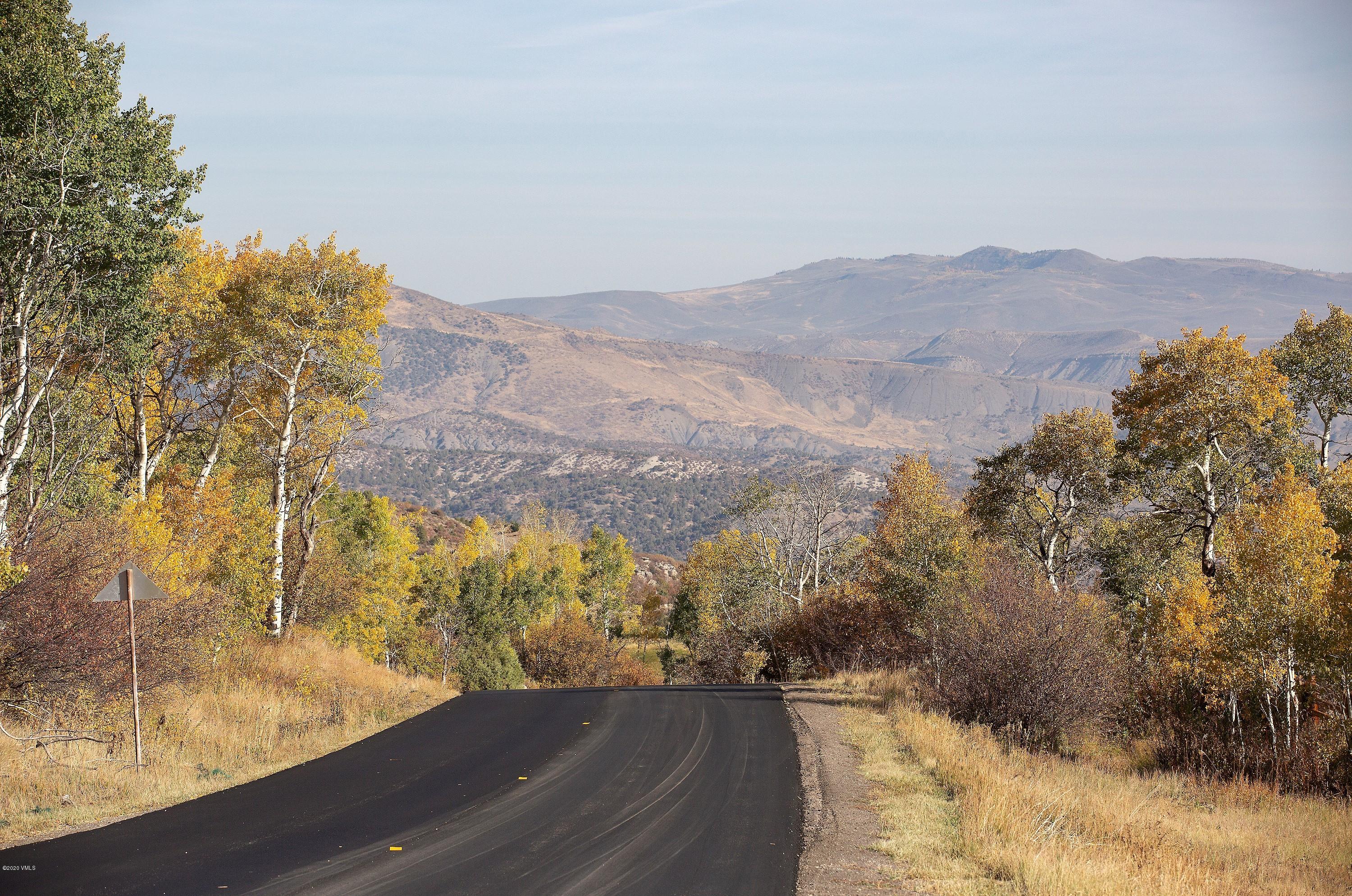 305 Jouflas Ranch Road Wolcott, CO 81655 - Photo 3 of 8 a view of a yard with a mountain