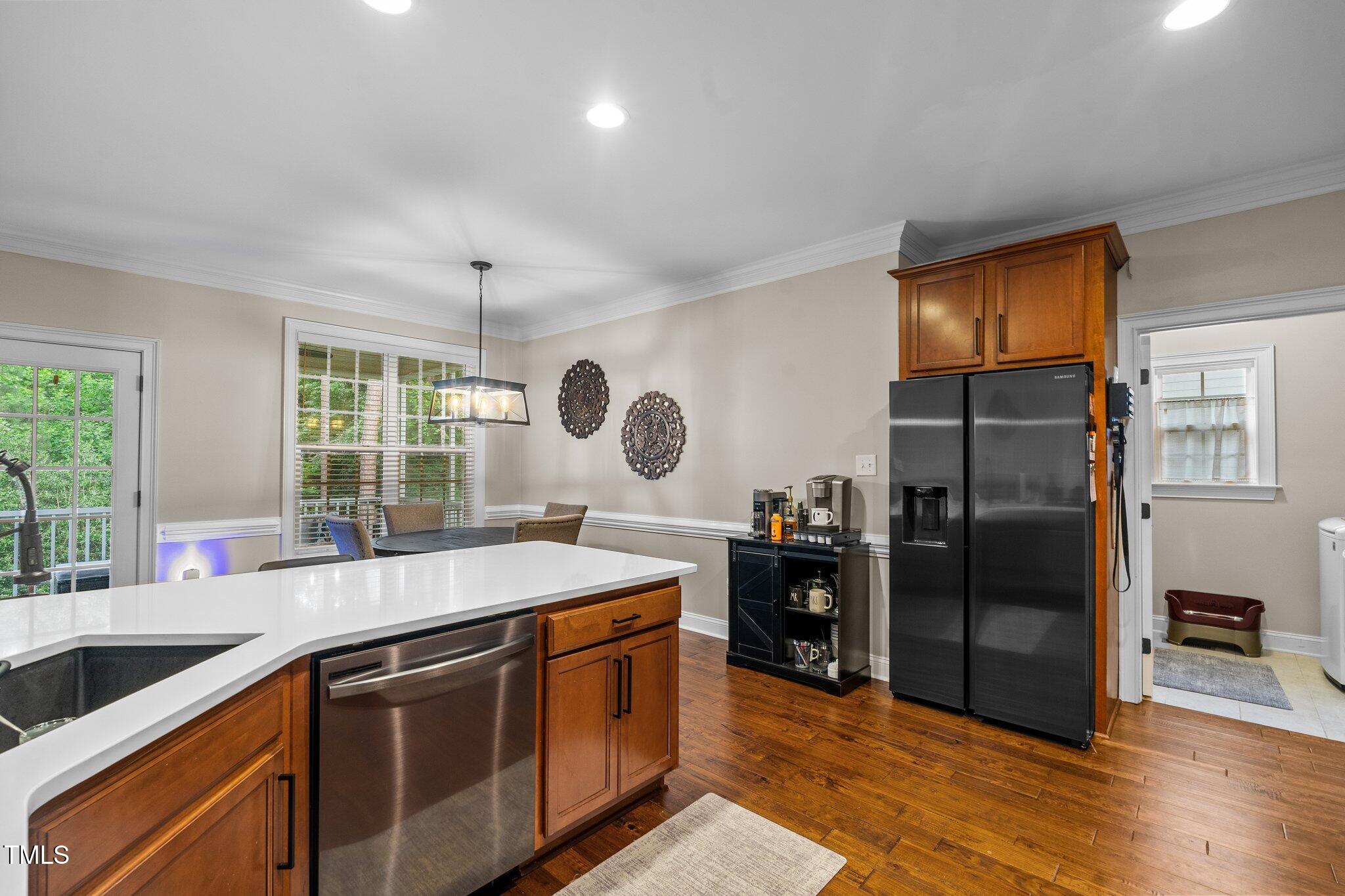 200 Heather Brook Circle Spring Lake, NC 28390 - Photo 14 of 36 a kitchen with stainless steel appliances granite countertop a sink and a refrigerator