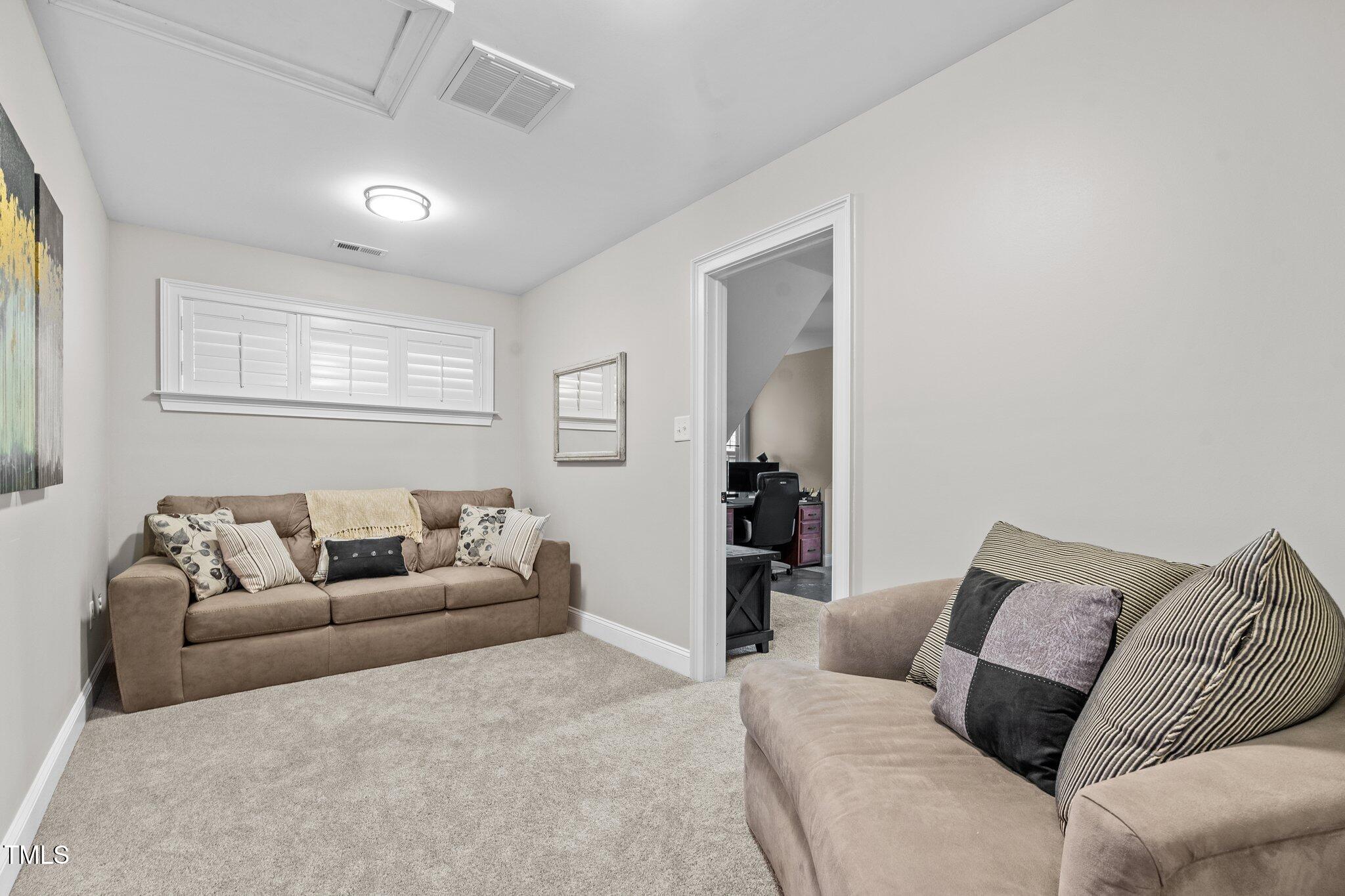 200 Heather Brook Circle Spring Lake, NC 28390 - Photo 21 of 36 a living room with a couch and a couch