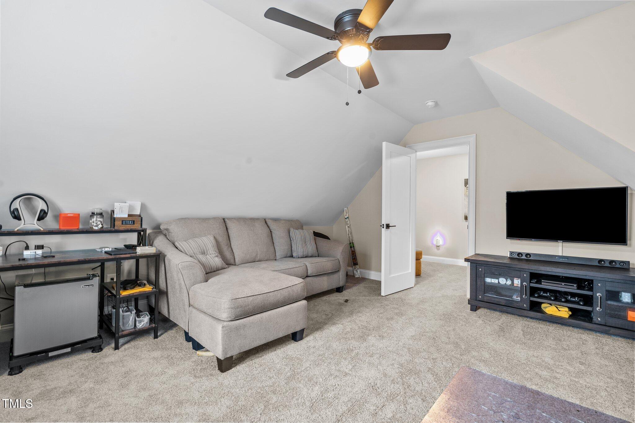 200 Heather Brook Circle Spring Lake, NC 28390 - Photo 23 of 36 a living room with furniture and a flat screen tv