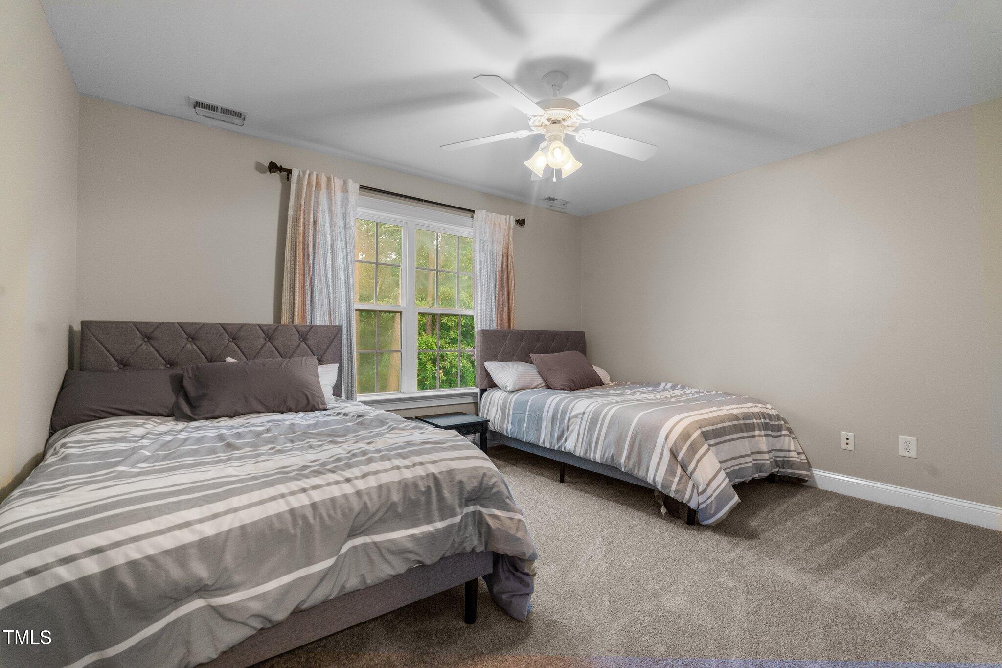 200 Heather Brook Circle Spring Lake, NC 28390 - Photo 24 of 36 a bedroom with bed and window
