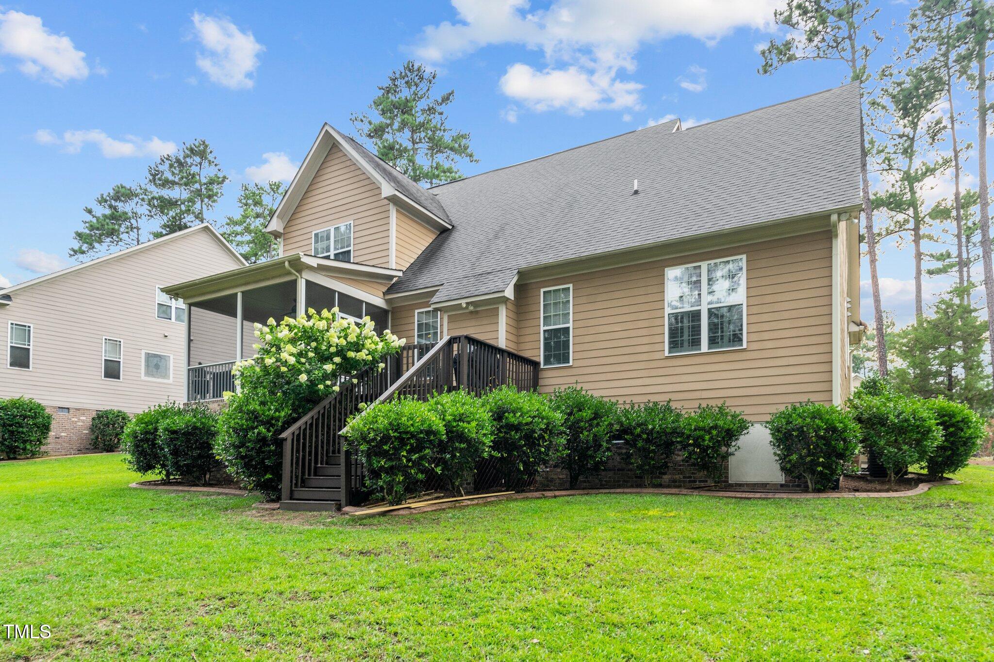 200 Heather Brook Circle Spring Lake, NC 28390 - Photo 31 of 36 a house that has a tree in front of it