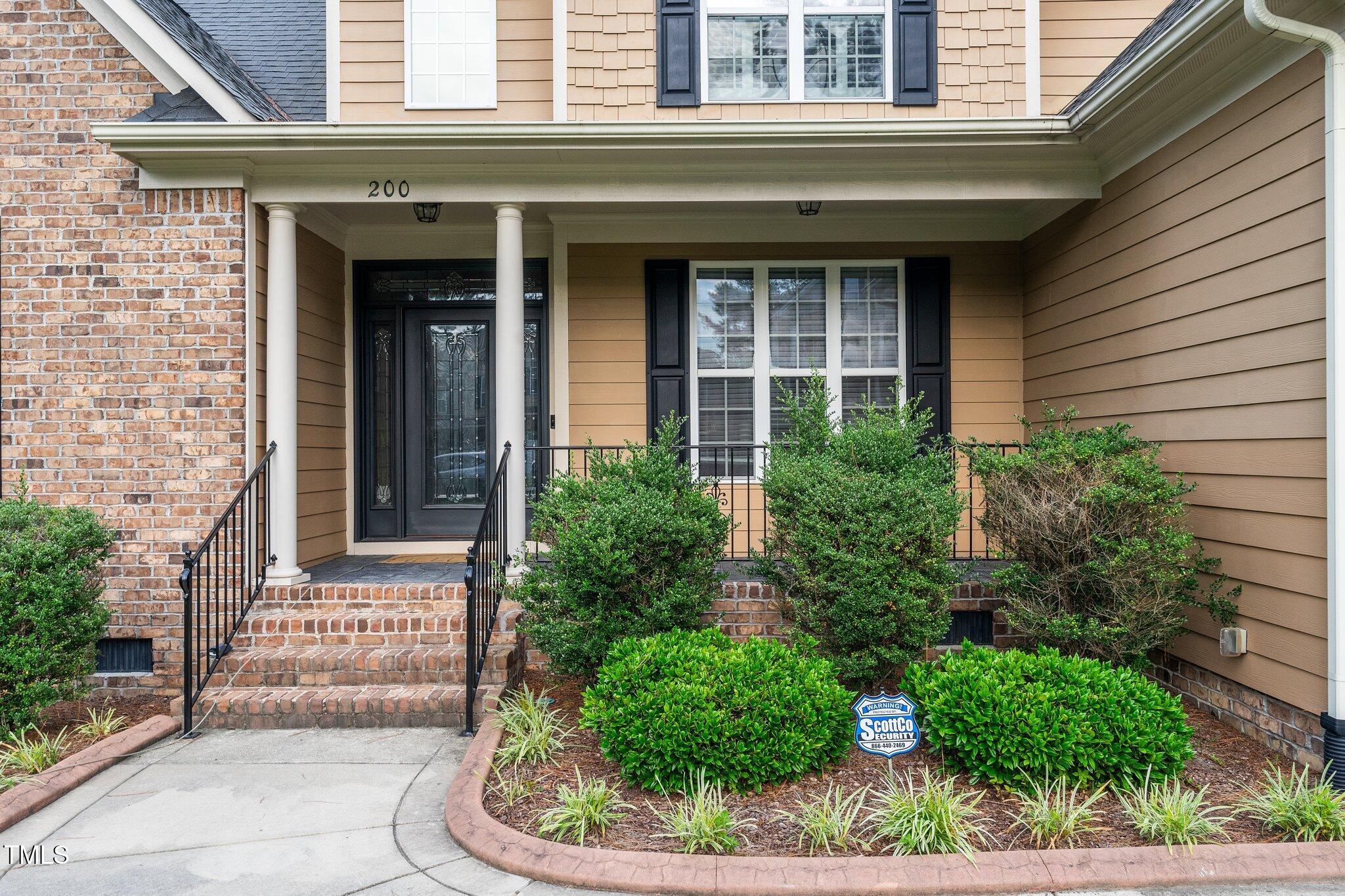 200 Heather Brook Circle Spring Lake, NC 28390 - Photo 35 of 36 a front view of a house with a garden