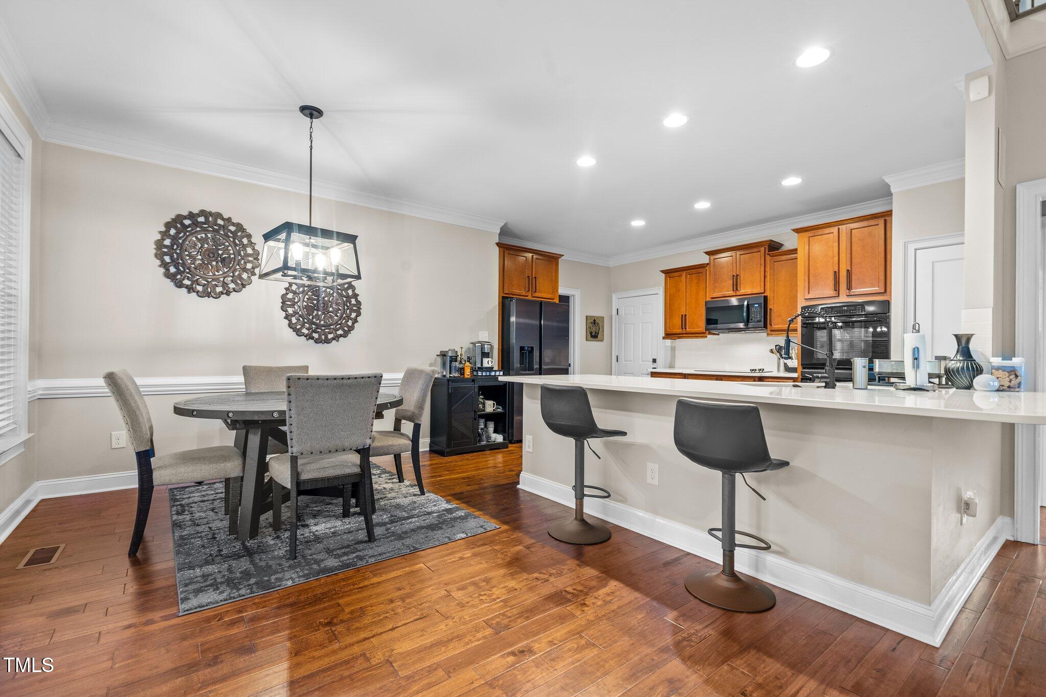 200 Heather Brook Circle Spring Lake, NC 28390 - Photo 5 of 36 a view of kitchen with cabinets table and chairs