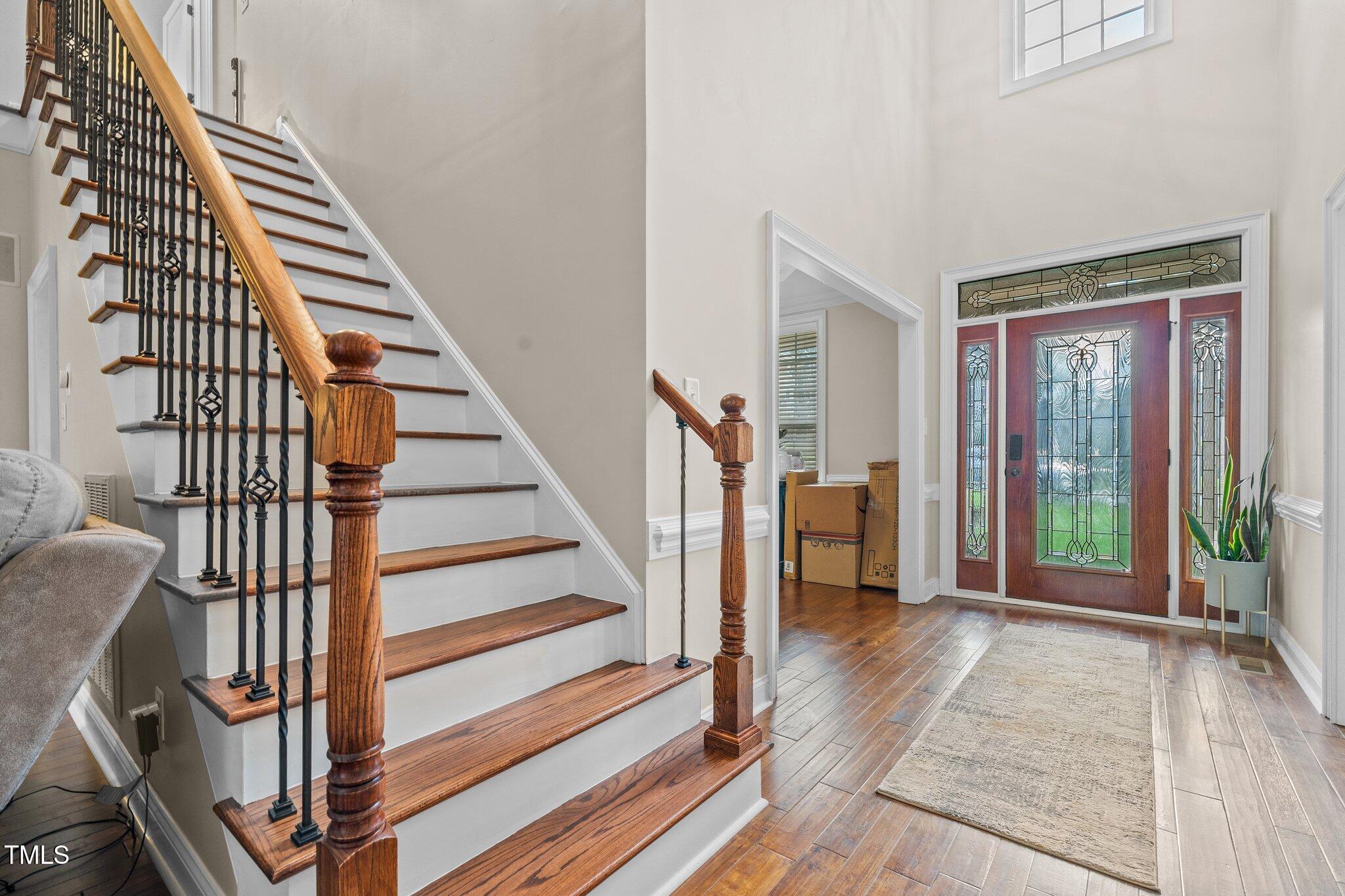 200 Heather Brook Circle Spring Lake, NC 28390 - Photo 7 of 36 a view of a hallway with wooden floor and staircase
