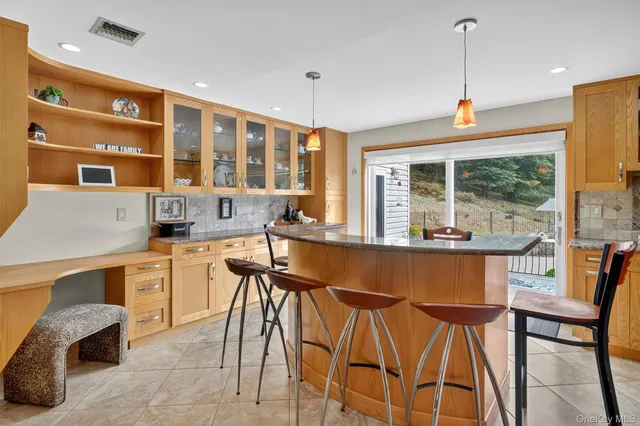 a large kitchen with a table and chairs