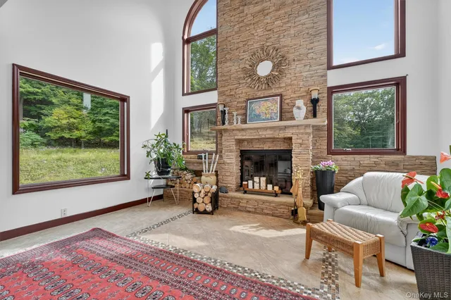 a view of living room with furniture and wooden floor