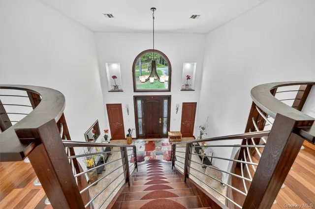 a bedroom with a bed and glass door