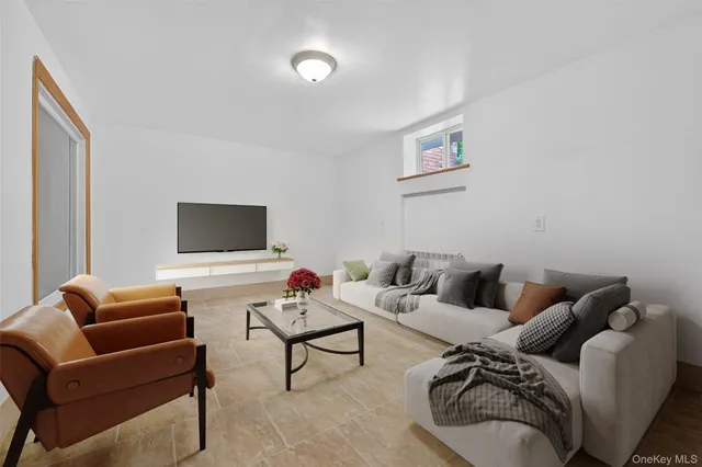 a living room with furniture and a window