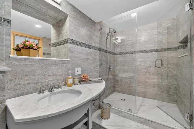 a view of a backyard with plants and chairs