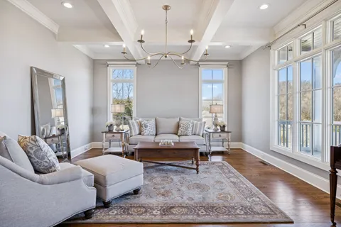a view of a workspace with furniture and a potted plant