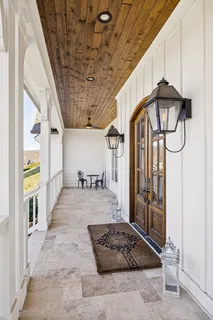a living room with furniture fireplace and flat screen tv