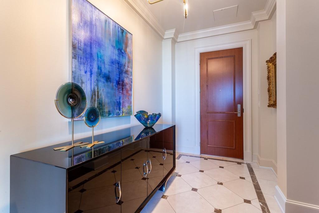 2525 North Pearl Street, Unit 1201 Dallas, TX 75201 - Photo 2 of 40 Crema Marfil marble entry inlaid with Light Emperador marble.