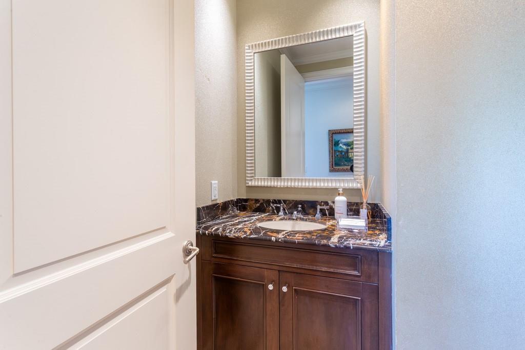 2525 North Pearl Street, Unit 1201 Dallas, TX 75201 - Photo 29 of 40 Powder Room boasts Imperial Brown marble counters & Crema Marfil inlaid floor.