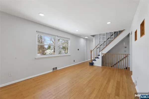 a view of entryway with wooden floor