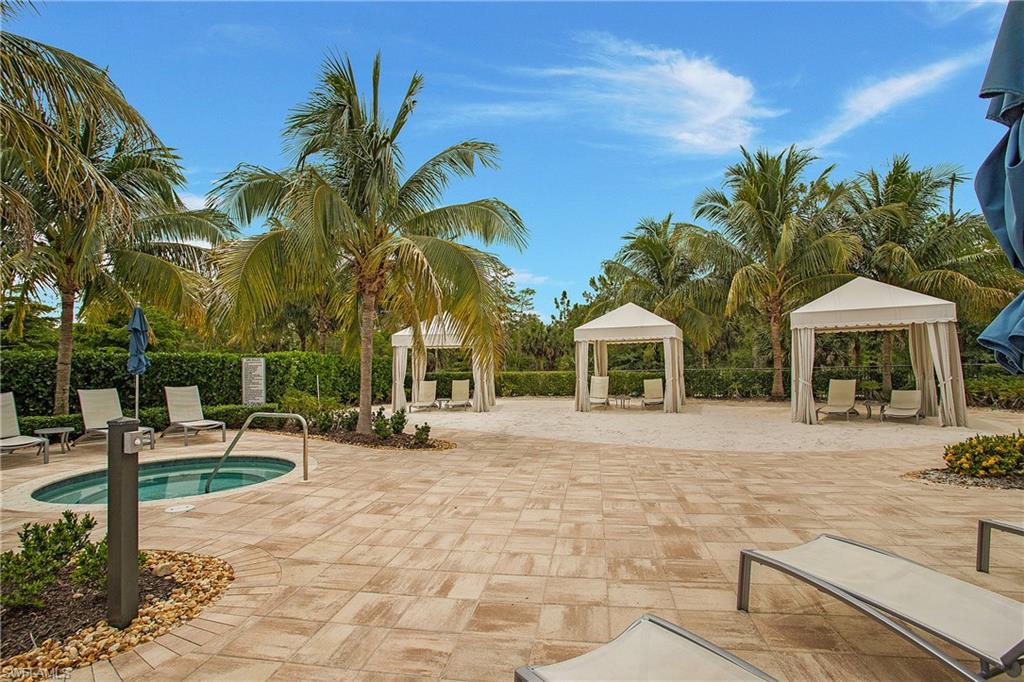 7674 Jacaranda Lane Naples, FL 34114 - Photo 37 of 45 a front view of a house with entertaining space