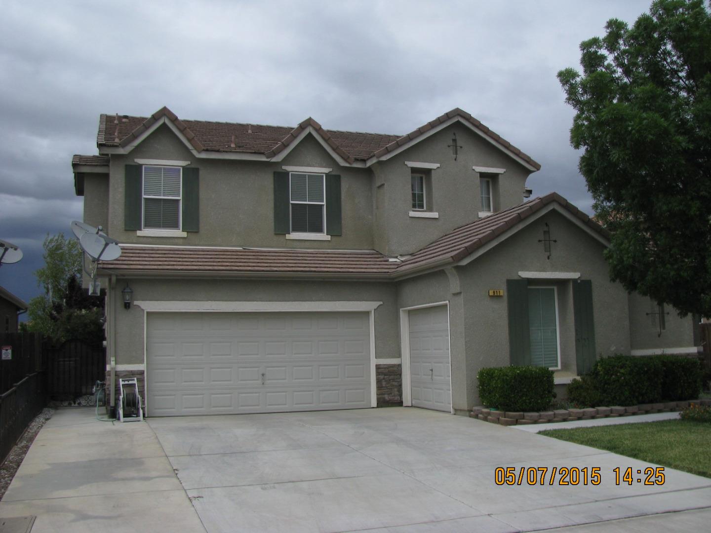 911 Azalea Court Los Banos, CA 93635 - Photo 1 of 5 a view of house with yard and garage