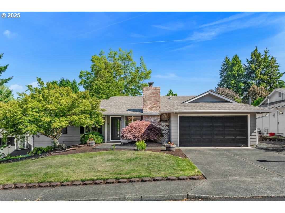 11595 Southwest Fairview Lane Tigard, OR 97223 - Photo 1 of 46 a front view of a house with garden