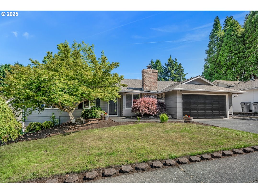 11595 Southwest Fairview Lane Tigard, OR 97223 - Photo 2 of 46 a front view of a house with a yard