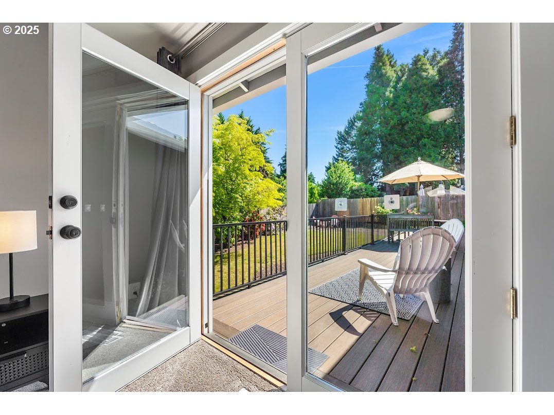 11595 Southwest Fairview Lane Tigard, OR 97223 - Photo 23 of 46 a view of a balcony with chair and wooden floor