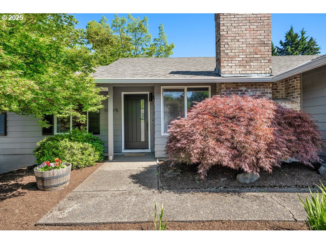 11595 Southwest Fairview Lane Tigard, OR 97223 - Photo 3 of 46 a view of a house with a garden