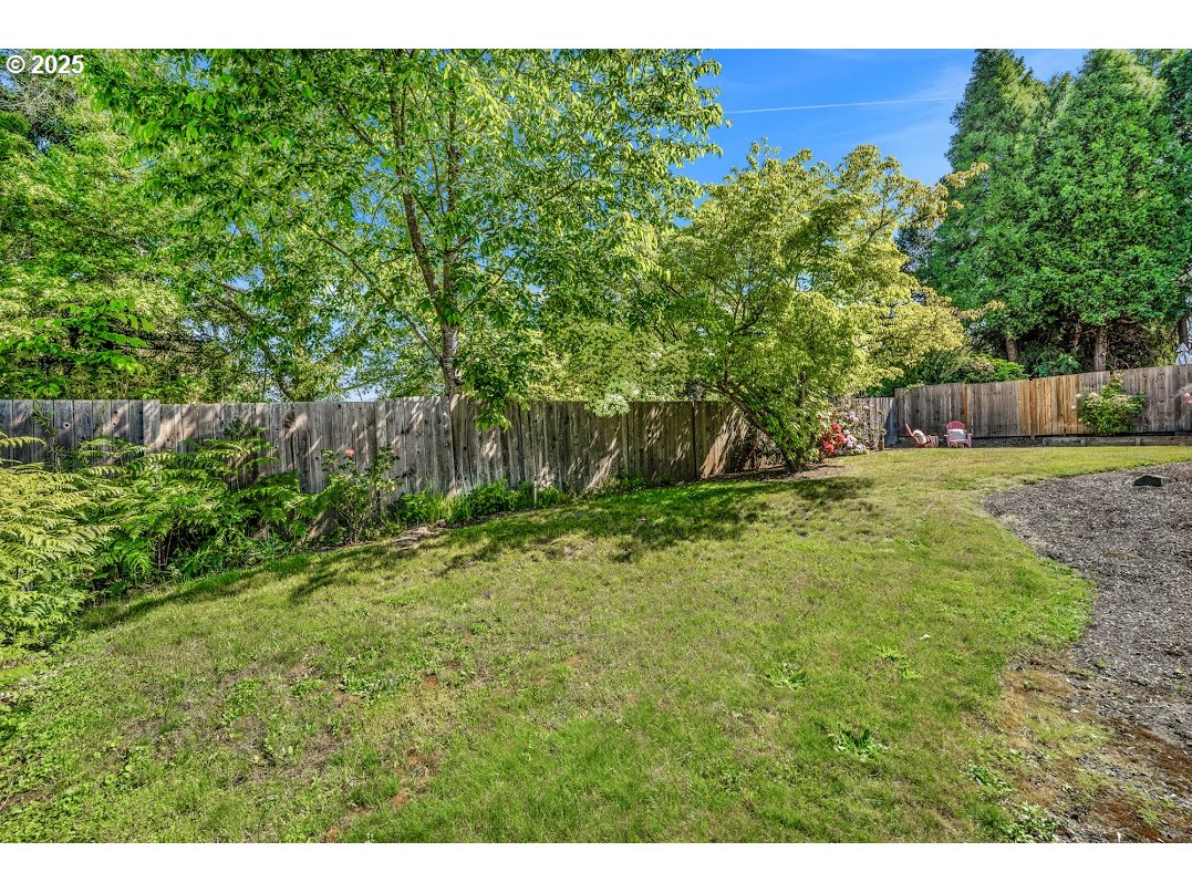 11595 Southwest Fairview Lane Tigard, OR 97223 - Photo 35 of 46 a backyard of a house with lots of green space