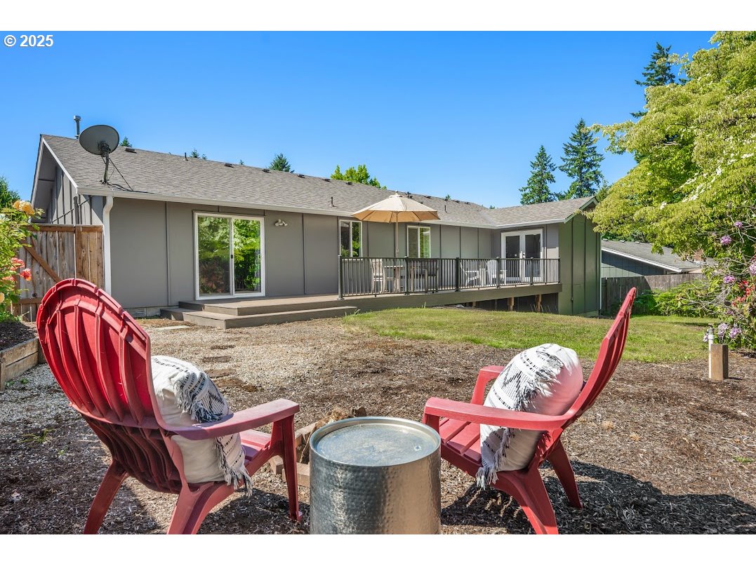 11595 Southwest Fairview Lane Tigard, OR 97223 - Photo 36 of 46 a backyard of a house with barbeque oven table and chairs